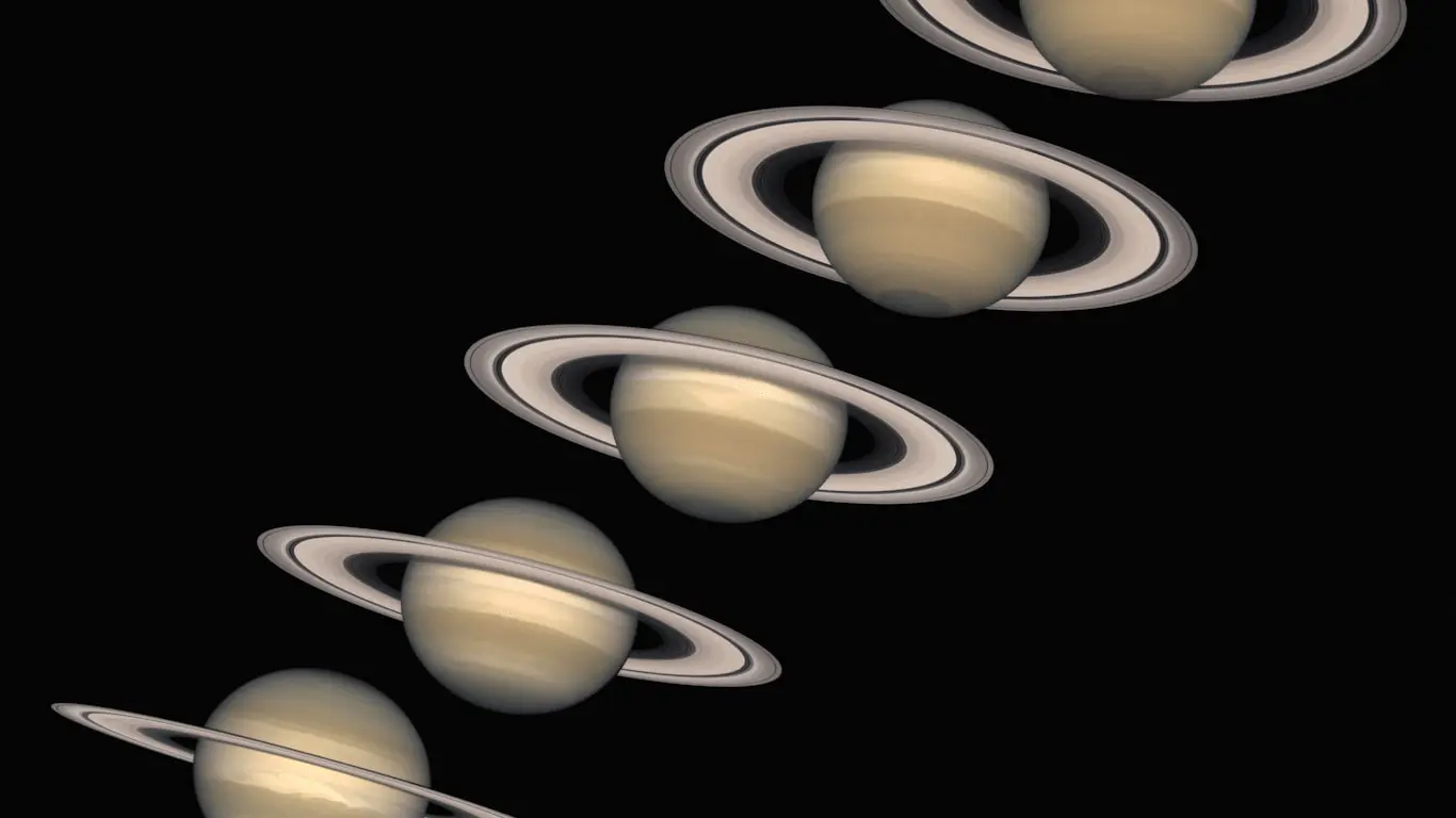 A series of Saturn images taken by the Hubble Space Telescope between 1996 and 2000, showing the rings opening progressively over the planet’s 29-year orbit.